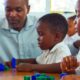 teacher with students playing blocks