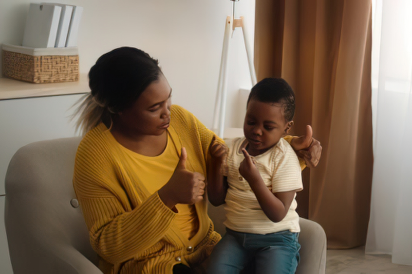 Mother and young child sharing a happy moment on a sofa at home