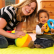 Baby enjoying playtime using a stacker toy